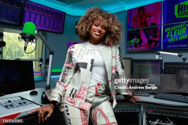 Fleur East attends the launch of the new Hits Radio breakfast show with Fleur East, Greg Burns and James Barr at Hits Radio on July 12, 2019 in...