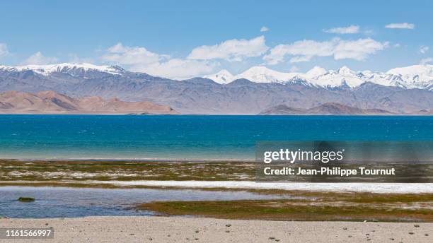 the amazing color of karakul lake, tajikistan, central asia - second highest stock pictures, royalty-free photos & images