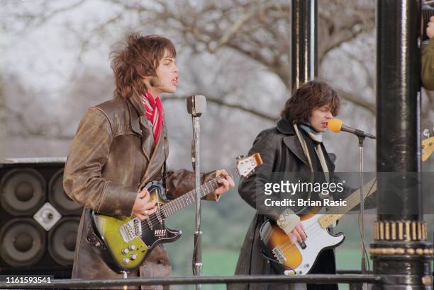Guitarist Gaz Coombes and bass guitarist Mick Quinn of English rock group Supergrass pictured during a video shoot for the band's new single 'Going...