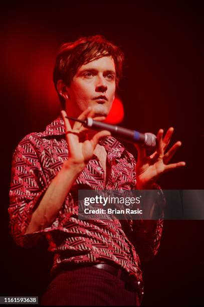 English singer and musician Jarvis Cocker performs live on stage with rock group Pulp at Wembley Arena in London on 2nd March 1996.