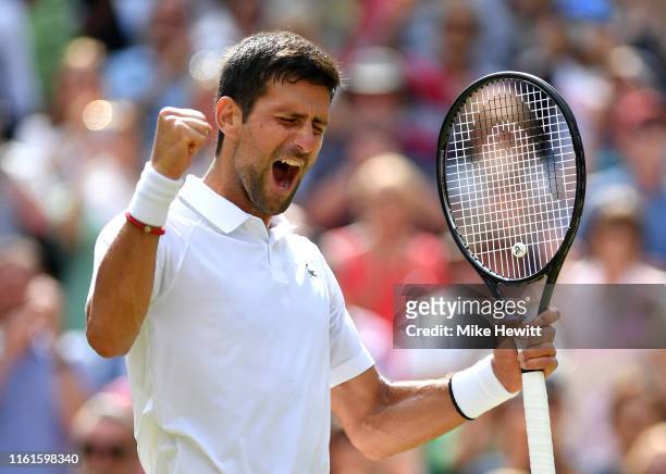 Novak Djokovic of Serbia celebrates victory in his Men's Singles semi-final match against Roberto Bautista Agut of Spain during Day eleven of The...