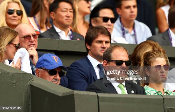 Robert Federer, father of Roger Federer, Tony Godsick agent of Roger Federer and Mirka Federer wife of Roger Federer look on prior to the Men's...