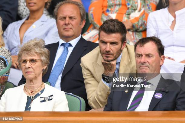Birgitte, Duchess of Gloucester, David Beckham and Wimbledon Chairman Ph1ilip Brook on Centre Court during day eleven of the Wimbledon Tennis...