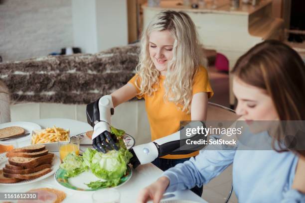 making sandwiches with friends - artificial limb stock pictures, royalty-free photos & images