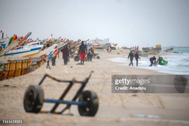 General view of the fishers at the fishing market area on the shore in Nouakchott, Mauritania on August 11, 2019. Fishing is one of the most...