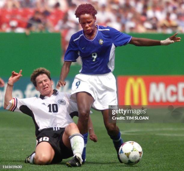 Germany's Bettina Wiegman falls after tangling with Brazil's Katia Da Silva during the first round of the 1999 FIFA Women's World Cup at Jack Kent...
