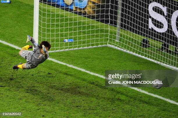 Japan's goalkeeper Ayumi Kaihori jumps for the ball during the FIFA Women's Football World Cup final match Japan vs USA on July 17, 2011 in Frankfurt...