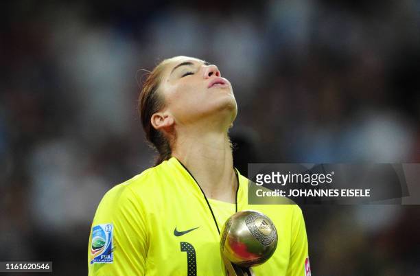 S goalkeeper Hope Solo reacts with the "Golden Ball" after the FIFA Women's Football World Cup final match Japan vs USA on July 17, 2011 in Frankfurt...