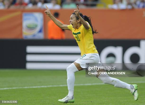 Brazil's striker Marta celebrates scoring 2-1 goal during the quarter-final match of the FIFA women's football World Cup Brazil vs USA on July 10,...