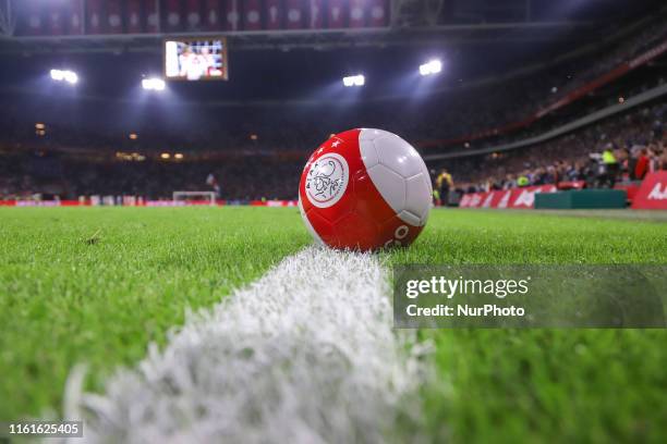 Ball with the logo symbol of Ajax on the grass after the FC AJAX Amsterdam vs PAOK Salonika football match game with score 3-2 for the UEFA Champions...