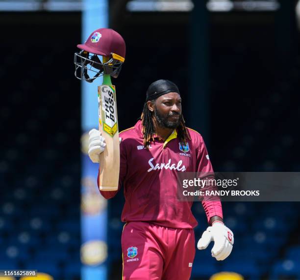 Chris Gayle of West Indies celebrates his half century during the 3rd ODI match between West Indies and India at Queens Park Oval, Port of Spain,...
