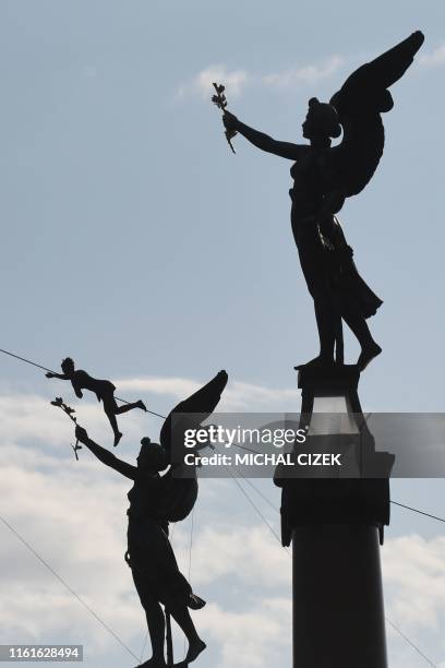 French tightrope artist Tatiana-Mosio Bongonga is seen on the 350-metre highline above the Vltava river on August 14, 2019 in the Czech capital...
