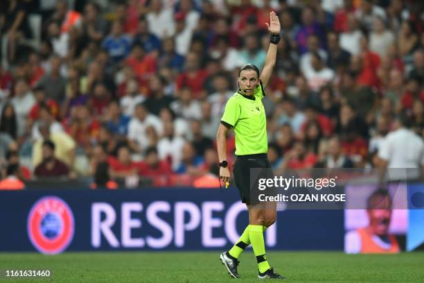 French referee Stephanie Frappart gestures during the UEFA Super Cup 2019 football match between FC Liverpool and FC Chelsea at Besiktas Park Stadium...
