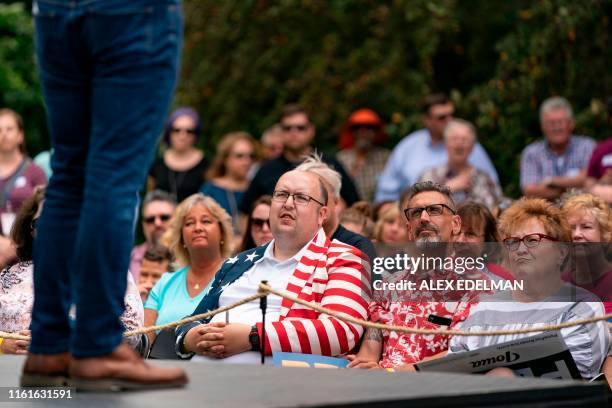 Supporters listen as 2020 Democratic Presidential hopeful Pete Buttigieg speaks during a campaign event in Muscatine, Iowa on August 14, 2019. -...