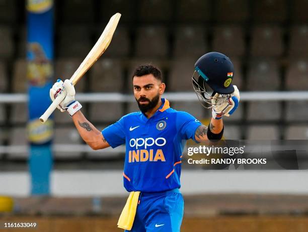 Virat Kohli of India celebrates his century during the 3rd ODI match between West Indies and India at Queens Park Oval, Port of Spain, Trinidad and...