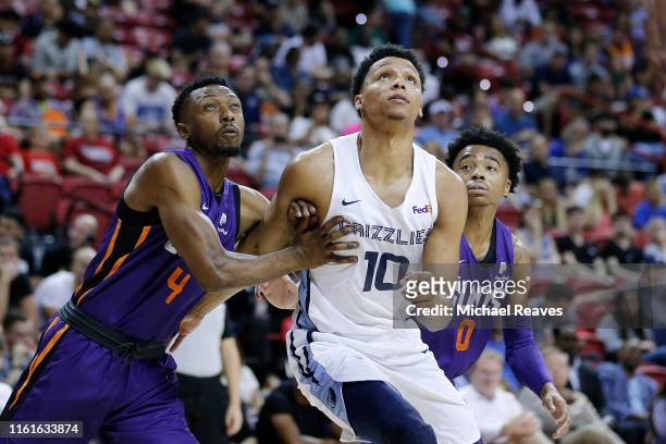 Ivan Rabb of the Memphis Grizzlies battles for position with Dakarai Tucker and Jalen Lecque of the Phoenix Suns during the 2019 Summer League at the...