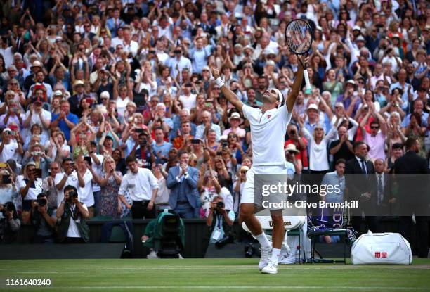 Roger Federer of Switzerland celebrates victory in his Men's Singles semi-final match against Rafael Nadal of Spain during Day eleven of The...