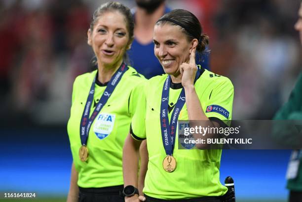 French referee Stephanie Frappart smiles next to French assistant referee Manuela Nicolosi after the UEFA Super Cup 2019 football match between FC...