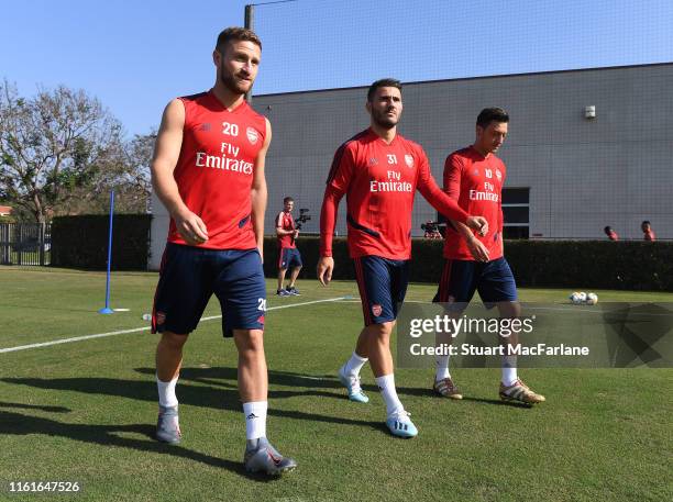 Shkodran Mustafi, Sead Kolasinac and Mesut Ozil of Arsenal before a training session at the Loyola Marymount University on July 12, 2019 in Los...