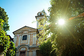 The old cathedral in sunlight. Church of Santo Stefano, Corconio, Italy.
