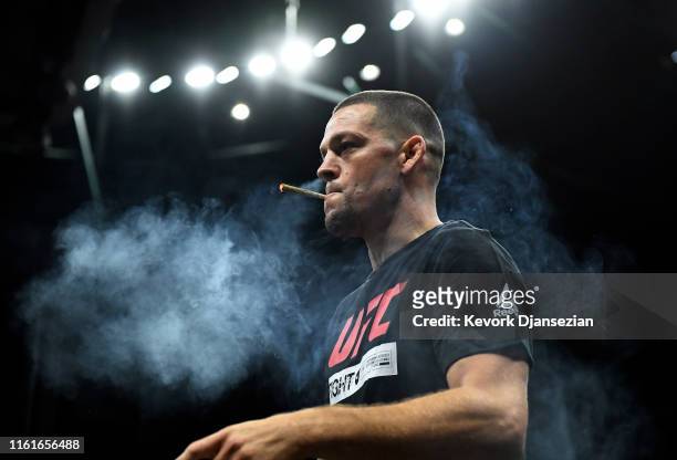 Former UFC lightweight title challenger Nate Diaz smokes during an open workout for fans and media at Honda Center on August 14, 2019 in Anaheim,...