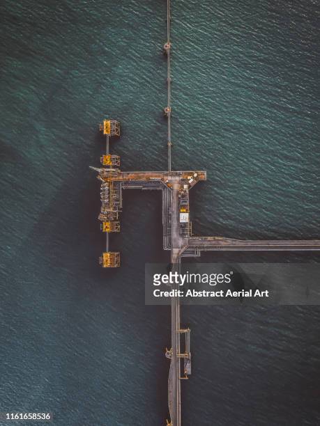 aerial view of a pipeline, milford haven, wales, united kingdom - oil rig uk stock pictures, royalty-free photos & images