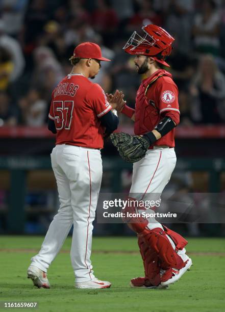 Los Angeles Angels pitcher Hansel Robles and Los Angeles Angels catcher Anthony Bemboom on the field after the Angels defeated the Pittsburgh Pirates...