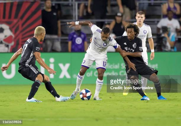 Orlando City forward Nani gets fouled by Sporting Kansas City forward Gianluca Busio during the MLS soccer match between the Orlando City SC and...