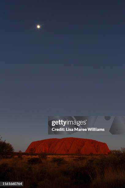 Uluru as seen from the sunset viewing area on August 13, 2019 in the Uluru-Kata Tjuta National Park, Australia. The Uluru-Kata Tjuta National Park...