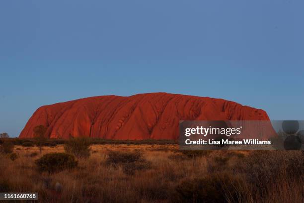 Uluru as seen from the sunset viewing area on August 13, 2019 in the Uluru-Kata Tjuta National Park, Australia. The Uluru-Kata Tjuta National Park...