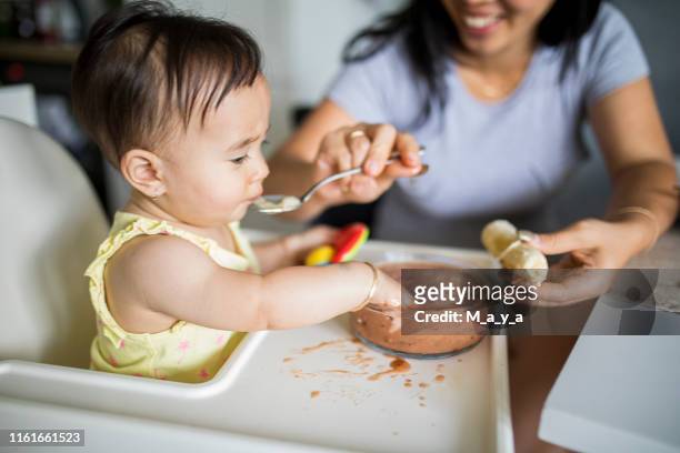 messy eating - baby m stock pictures, royalty-free photos & images