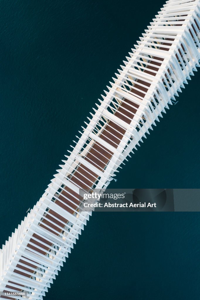 Diagonal aerial shot of bridge crossing a river, United Arab Emirates