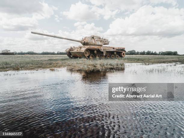 abandoned tank in a german field - tank stock pictures, royalty-free photos & images