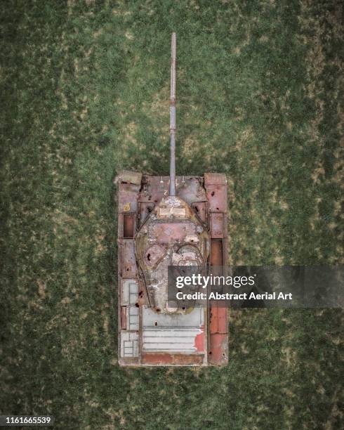 drone shot looking down on an abandoned tank, germany - panzer stock-fotos und bilder