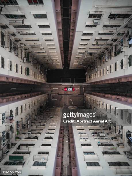 Taxi parked at the bottom of a building atrium, Hong Kong