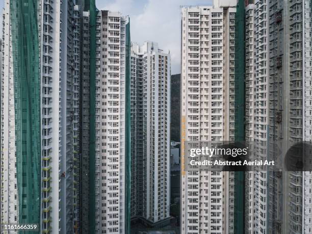 urban drone shot of multiple high rise buildings, hong kong - high rise stock-fotos und bilder