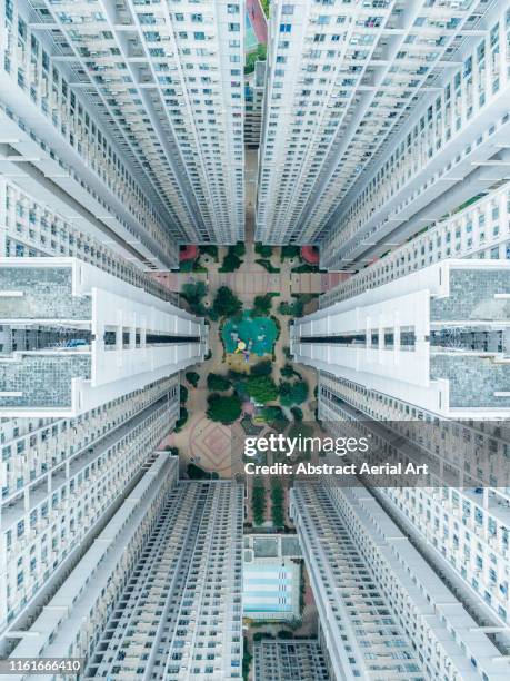 looking down on building complex, tseung kwan o, kowloon, hong kong - vertigo foto e immagini stock