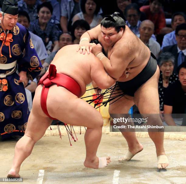 Ozeki Takayasu throws Daieisho to win on day six of the Grand Sumo Nagoya Tournament at the Dolphins Arena on July 12, 2019 in Nagoya, Aichi, Japan.