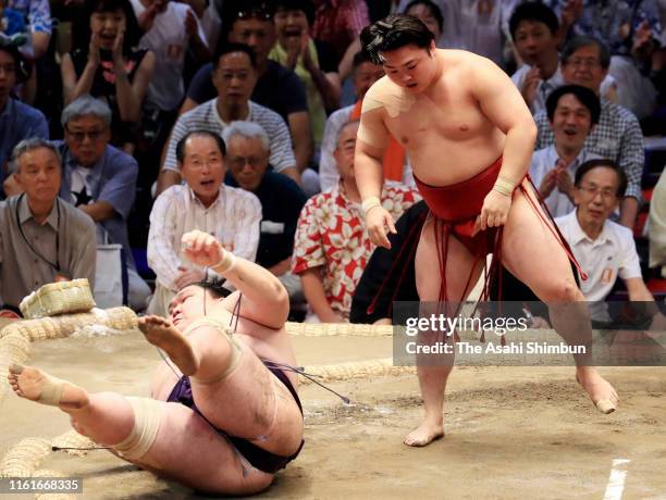 Enho throws Yago to win on day six of the Grand Sumo Nagoya Tournament at the Dolphins Arena on July 12, 2019 in Nagoya, Aichi, Japan.