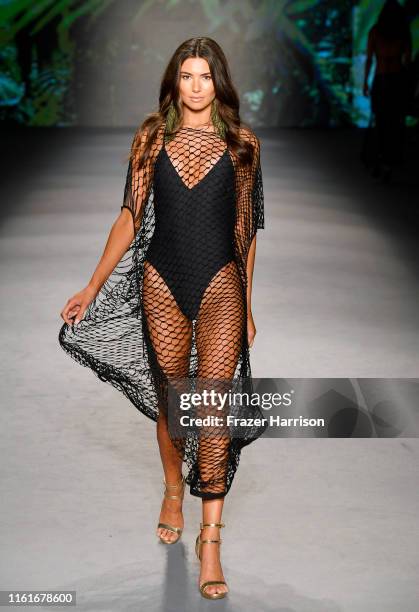 Model walks the runway during Aguaclara Fashion Show - Paraiso Miami Beach at The Paraiso Tent on July 12, 2019 in Miami Beach, Florida.