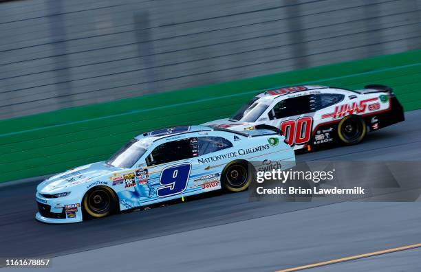 Noah Gragson, driver of the Nationwide Children's Chevrolet, leads, Cole Custer, driver of the Haas Automation Ford, during the NASCAR Xfinity Series...