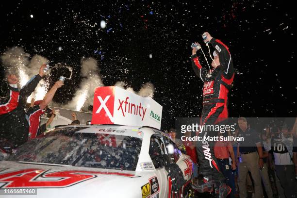 Cole Custer, driver of the Haas Automation Ford, celebrates in Victory Lane after winning the NASCAR Xfinity Series Alsco 300 at Kentucky Speedway on...