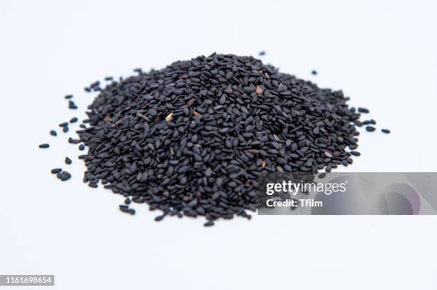 black sesame on white background - sesam stock-fotos und bilder