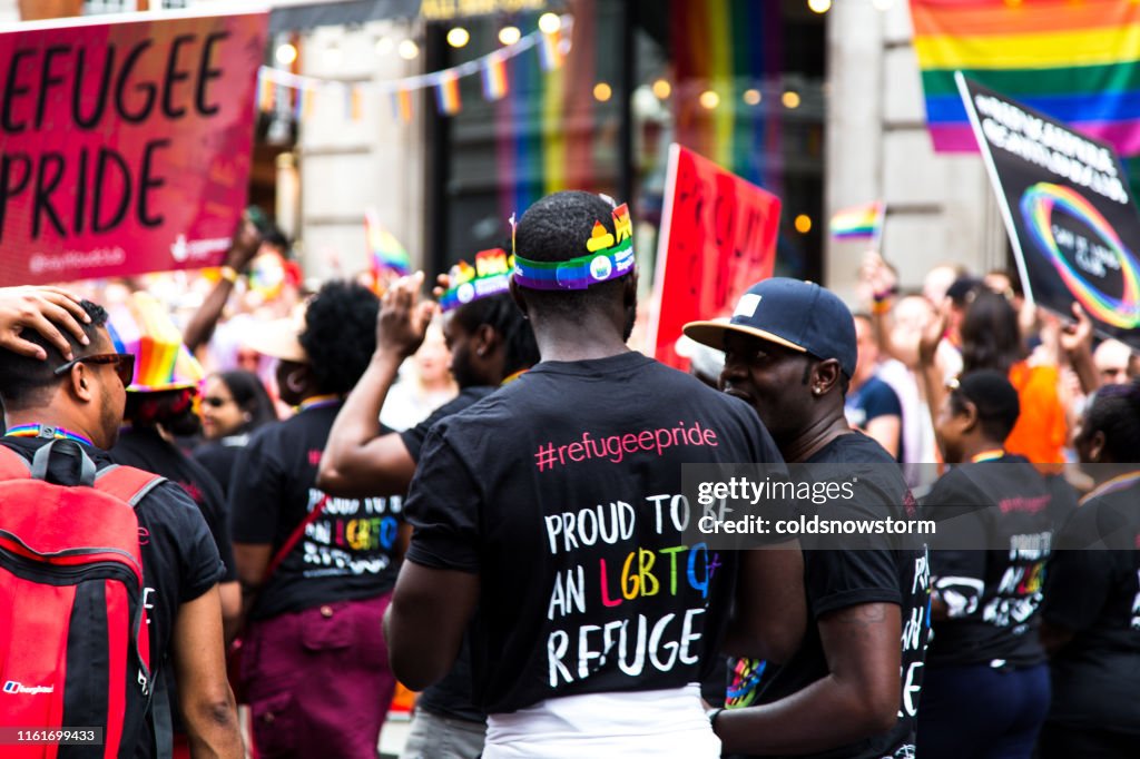 Gay Refugees celebrating at Gay Pride Parade on streets of central London, UK