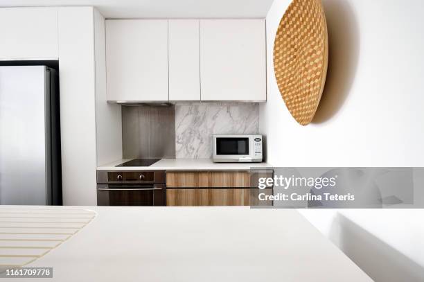 kitchen in a modern luxury condo - microwave oven stockfoto's en -beelden