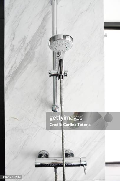 shower head in a luxury glass and marble shower - shower head stock pictures, royalty-free photos & images