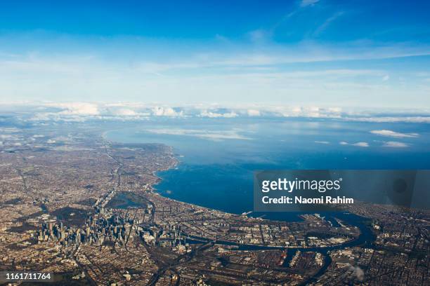 aerial view of perth cbd, swan river, surrounding suburbs and the indian ocean on a sunny day - perth australia foto e immagini stock