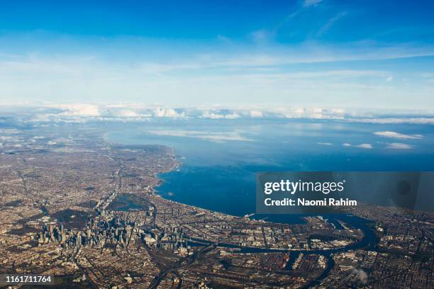 aerial view of perth cbd, swan river, surrounding suburbs and the indian ocean on a sunny day - perth property stock pictures, royalty-free photos & images