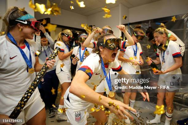 Kelley O'Hara of the USA celebrates with teammates in the locker room after the 2019 FIFA Women's World Cup France Final match between The United...