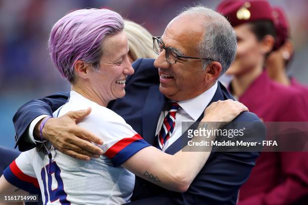 Megan Rapinoe of the USA hugs Carlos Cordeiro, President of the USA Soccer Federation, after the 2019 FIFA Women's World Cup France Final match...